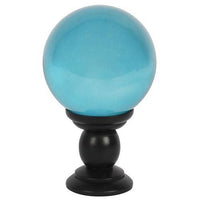 Large teal crystal ball on stand
